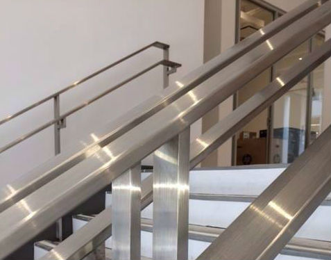 Stainless Staircase with Poured Cement Treads